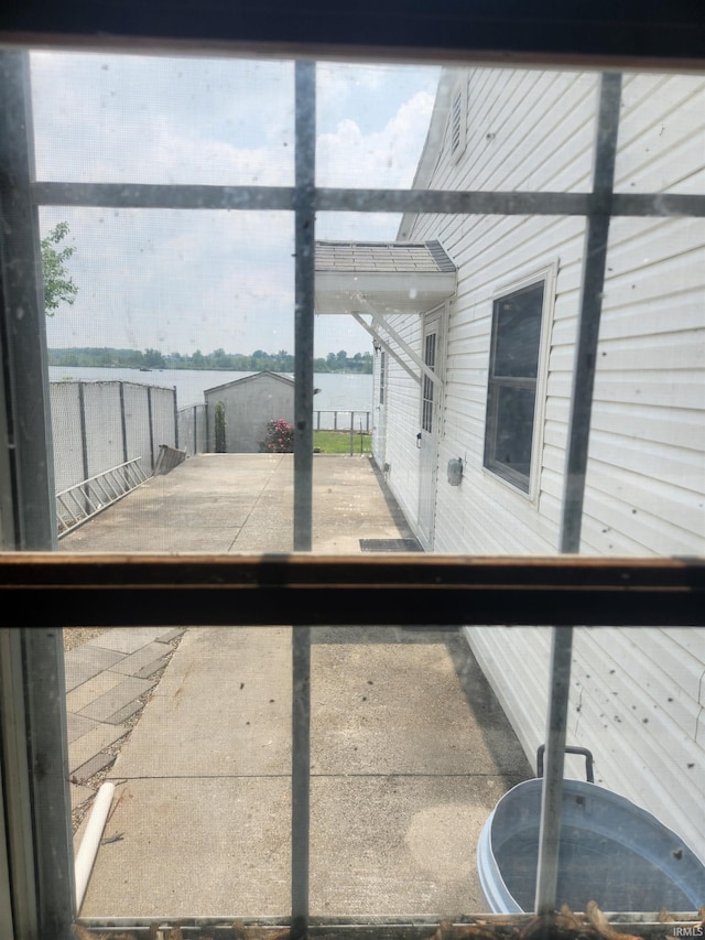 6480 E Mcguire Rd, Churubusco, IN 46723 - unfurnished sunroom featuring a water view and plenty of natural light