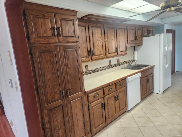 6480 E Mcguire Rd, Churubusco, IN 46723 - kitchen featuring white appliances, a ceiling fan, light countertops, brown cabinetry, and light tile patterned flooring