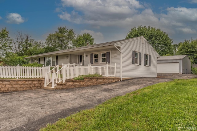 4260 W 3rd St, Bloomington, IN 47404 - ranch-style house with an outbuilding, a detached garage, and covered porch
