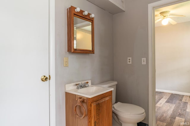 4260 W 3rd St, Bloomington, IN 47404 - bathroom with wood finished floors, vanity, and a ceiling fan