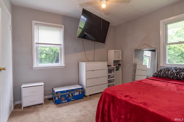 4260 W 3rd St, Bloomington, IN 47404 - carpeted bedroom with baseboards and a ceiling fan