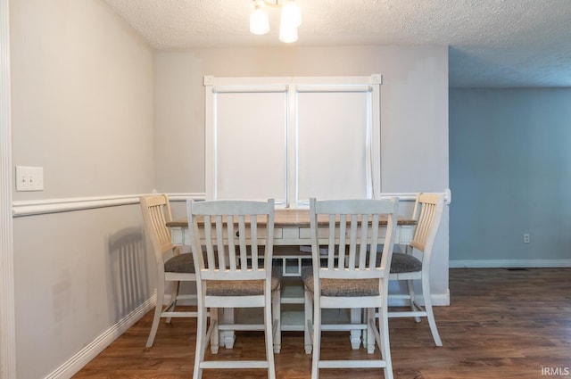 4260 W 3rd St, Bloomington, IN 47404 - dining room with wood finished floors and a textured ceiling