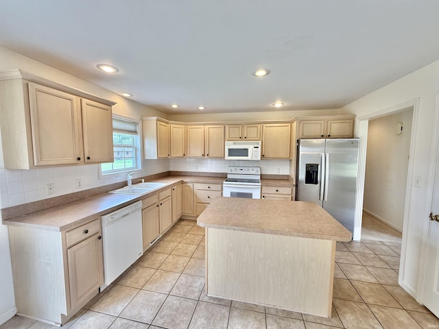 8433 Countrywood Ct, Newburgh, IN 47630 - kitchen with white appliances, light brown cabinetry, tasteful backsplash, a center island, and recessed lighting