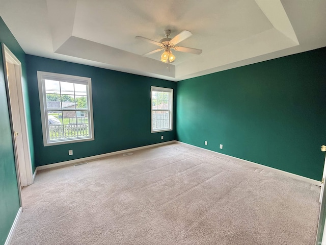 8433 Countrywood Ct, Newburgh, IN 47630 - carpeted empty room with a tray ceiling and a ceiling fan