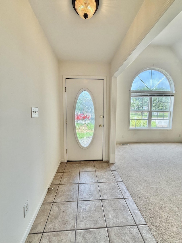 8433 Countrywood Ct, Newburgh, IN 47630 - foyer with light carpet and light tile patterned flooring