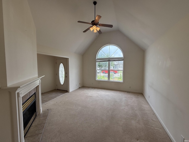 8433 Countrywood Ct, Newburgh, IN 47630 - unfurnished living room featuring ceiling fan, light carpet, lofted ceiling, and a tile fireplace