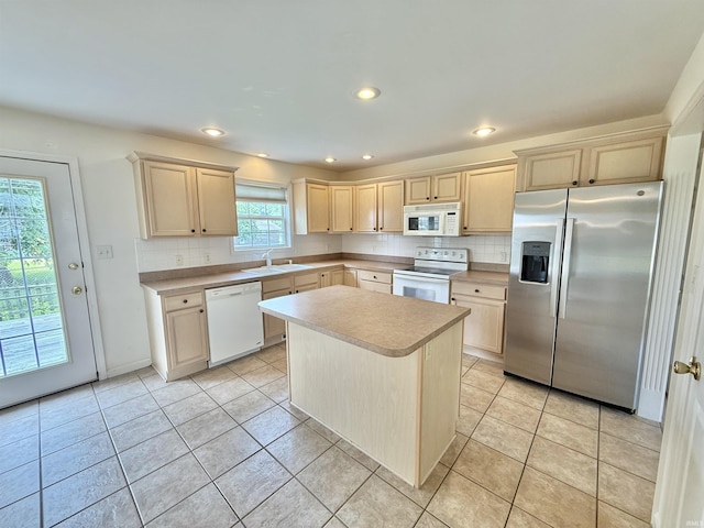 8433 Countrywood Ct, Newburgh, IN 47630 - kitchen with white appliances, light countertops, tasteful backsplash, light brown cabinets, and recessed lighting