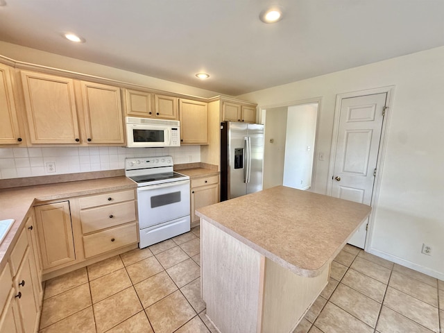 8433 Countrywood Ct, Newburgh, IN 47630 - kitchen featuring white appliances, light brown cabinetry, light tile patterned flooring, and recessed lighting