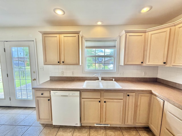 8433 Countrywood Ct, Newburgh, IN 47630 - kitchen with white dishwasher, plenty of natural light, light brown cabinets, and recessed lighting