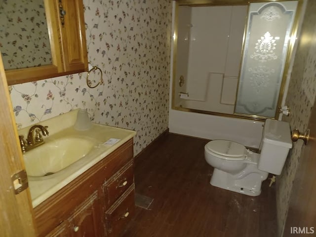 1612 Meadow St, Carmi, IL 62821 - full bath featuring wallpapered walls, vanity, wood finished floors, and shower / tub combination