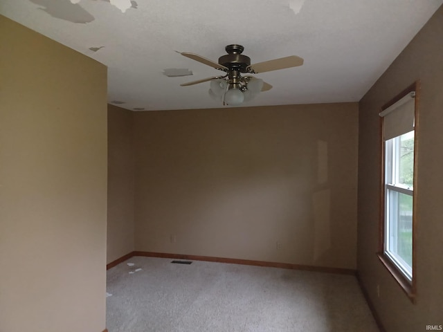 1612 Meadow St, Carmi, IL 62821 - spare room with a ceiling fan, plenty of natural light, and light colored carpet