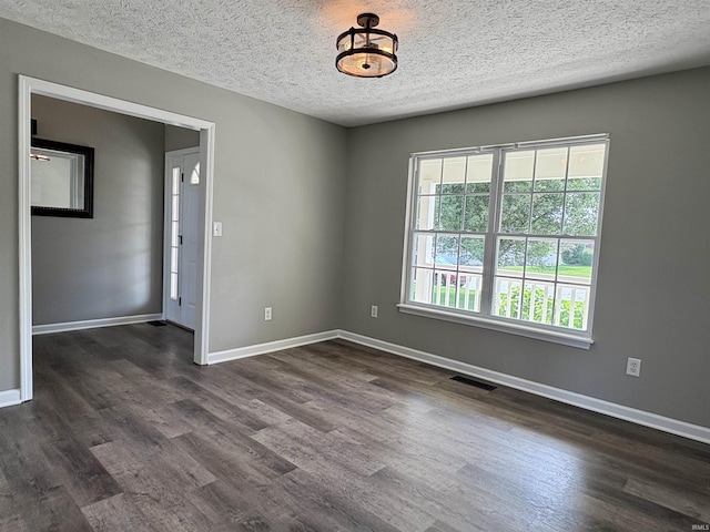 222 Sinclair Dr, West Lafayette, IN 47906 - spare room with dark wood-style flooring and a textured ceiling