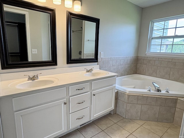 222 Sinclair Dr, West Lafayette, IN 47906 - bathroom with a garden tub, double vanity, and tile patterned flooring