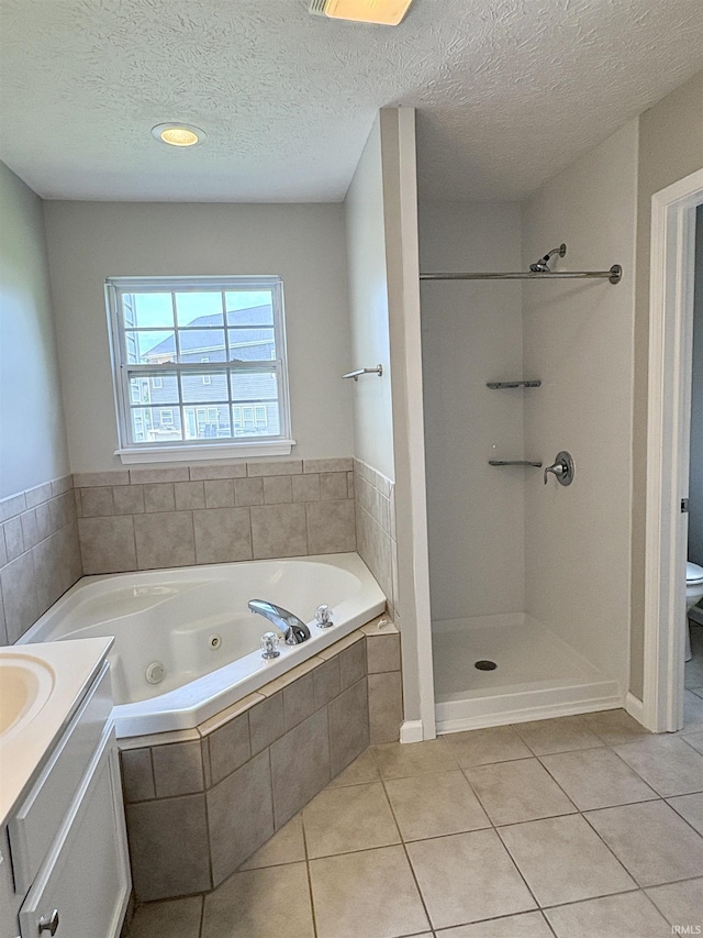 222 Sinclair Dr, West Lafayette, IN 47906 - bathroom with a jetted tub, tile patterned flooring, vanity, a textured ceiling, and a shower