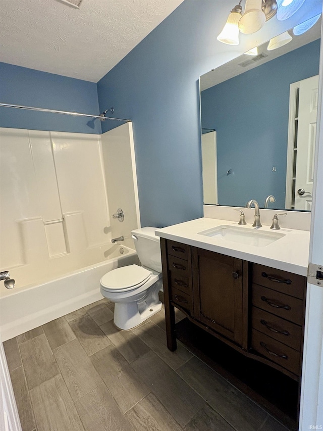 222 Sinclair Dr, West Lafayette, IN 47906 - full bathroom featuring wood finish floors, bathing tub / shower combination, vanity, and a textured ceiling