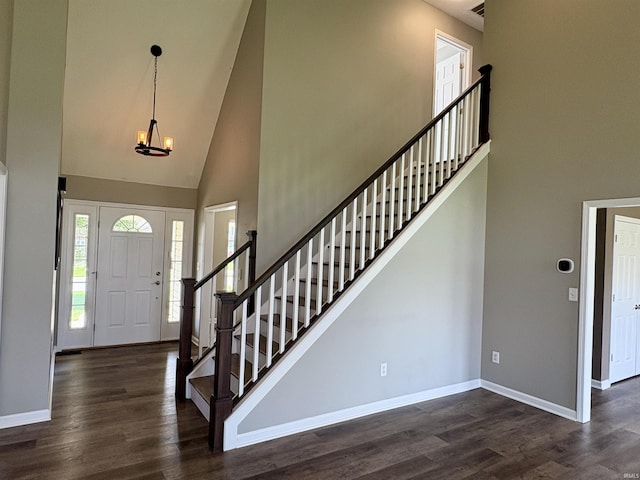222 Sinclair Dr, West Lafayette, IN 47906 - foyer entrance with high vaulted ceiling, a chandelier, stairway, and wood finished floors