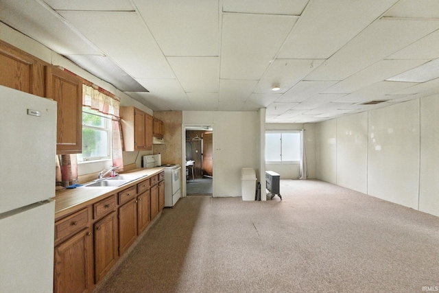 512 E Pike St, Kirklin, IN 46050 - kitchen featuring white appliances, brown cabinets, light colored carpet, and light countertops