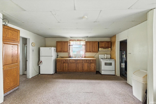 512 E Pike St, Kirklin, IN 46050 - kitchen with white appliances, brown cabinets, light countertops, and light colored carpet