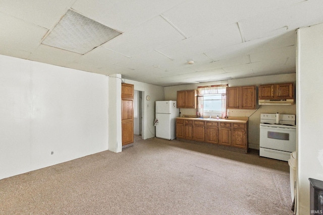 512 E Pike St, Kirklin, IN 46050 - kitchen with white appliances, brown cabinetry, light colored carpet, under cabinet range hood, and light countertops
