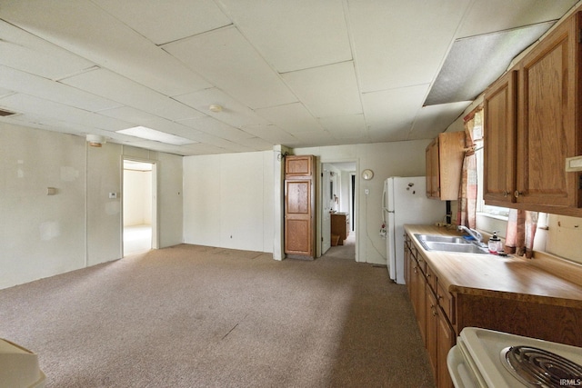 512 E Pike St, Kirklin, IN 46050 - kitchen featuring brown cabinets, carpet, white appliances, and light countertops