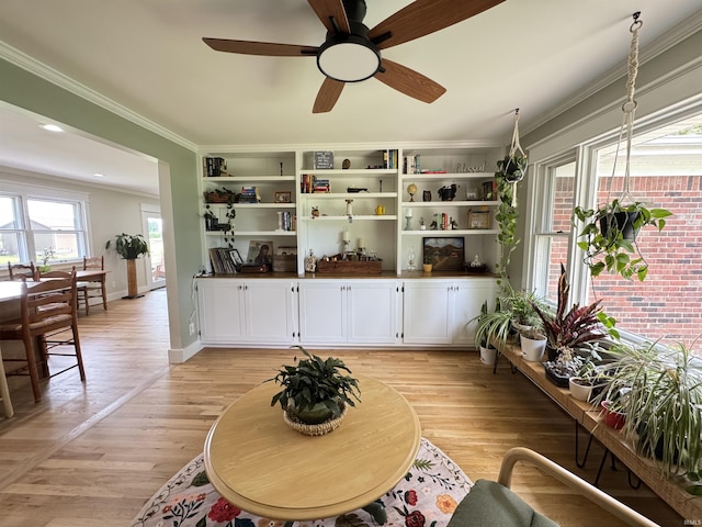 1635 Liberty St, Covington, IN 47932 - living area featuring crown molding, ceiling fan, and light wood finished floors