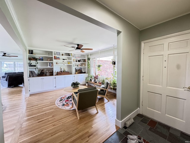 1635 Liberty St, Covington, IN 47932 - foyer entrance with ceiling fan, ornamental molding, healthy amount of natural light, and wood finished floors