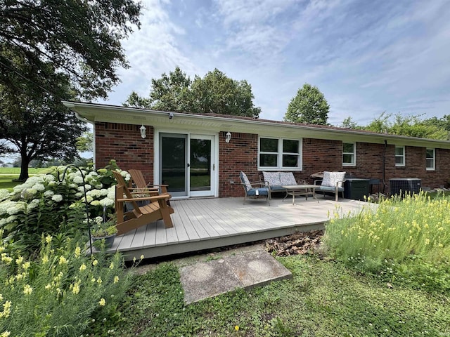 1635 Liberty St, Covington, IN 47932 - rear view of property with brick siding, a wooden deck, and outdoor lounge area