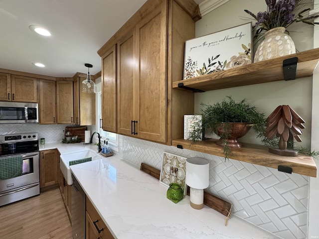 1635 Liberty St, Covington, IN 47932 - kitchen with appliances with stainless steel finishes, open shelves, brown cabinetry, decorative backsplash, and recessed lighting