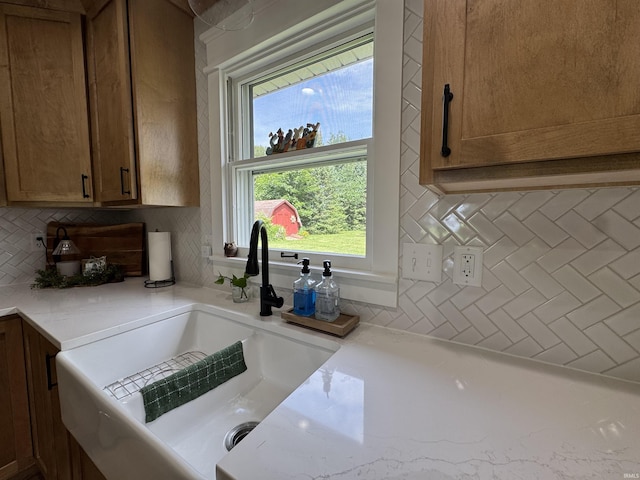 1635 Liberty St, Covington, IN 47932 - kitchen with decorative backsplash and brown cabinetry