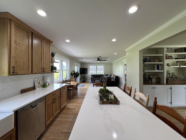 1635 Liberty St, Covington, IN 47932 - kitchen featuring dishwasher, crown molding, light stone counters, light wood-style flooring, and recessed lighting