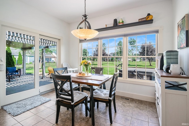 645 E Essex Dr, Warsaw, IN 46582 - dining room with light tile patterned flooring and baseboards