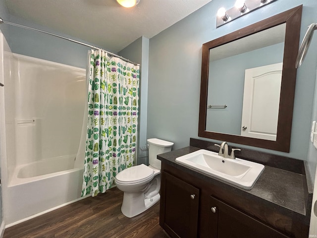 215 N Jefferson St, Lyons, IN 47443 - full bath featuring wood finished floors, vanity, and shower / tub combo
