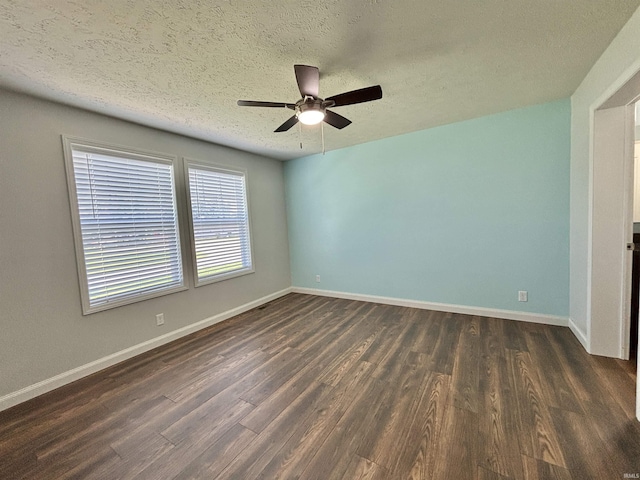 215 N Jefferson St, Lyons, IN 47443 - unfurnished room featuring dark wood-style flooring, a ceiling fan, and a textured ceiling