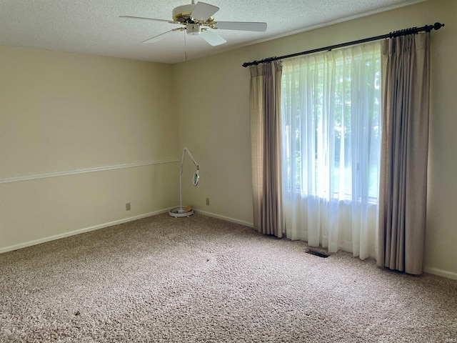 845 Crosspointe Ct, Wabash, IN 46992 - empty room with carpet, a ceiling fan, and a textured ceiling