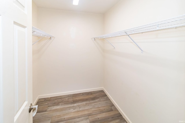 390 Mallard Cir, Chandler, IN 47610 - walk in closet featuring wood finished floors