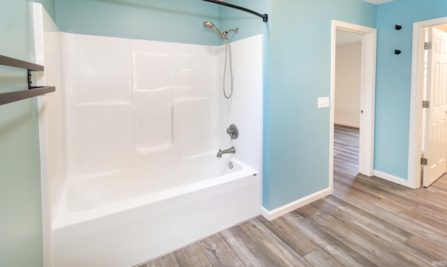 390 Mallard Cir, Chandler, IN 47610 - bathroom with wood finished floors and bathtub / shower combination