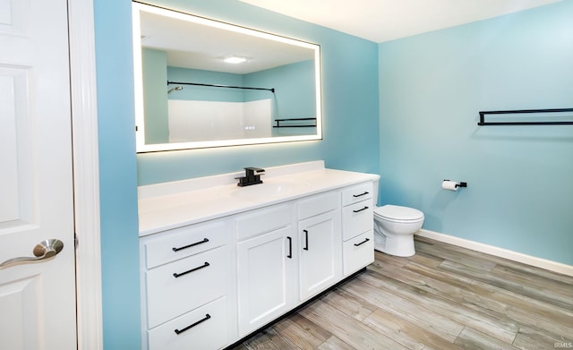 390 Mallard Cir, Chandler, IN 47610 - full bath featuring vanity, wood finished floors, and a shower