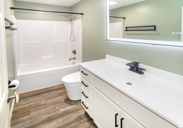 390 Mallard Cir, Chandler, IN 47610 - bathroom featuring vanity, shower / tub combination, and wood finished floors