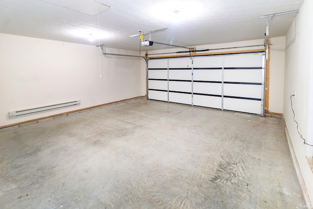 390 Mallard Cir, Chandler, IN 47610 - garage featuring a baseboard heating unit and a garage door opener