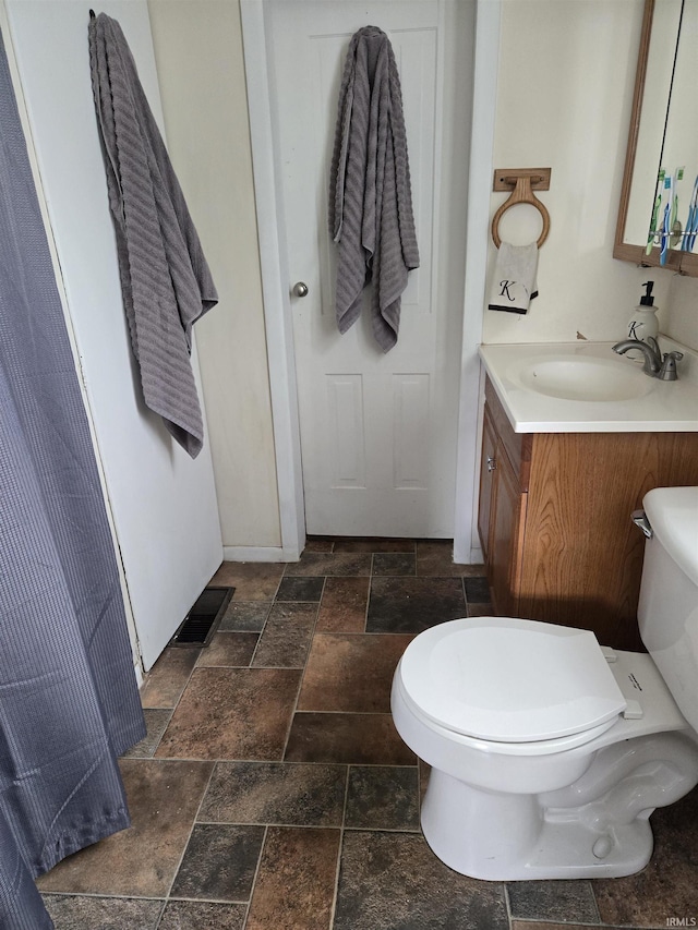 221 W 11th St, Bicknell, IN 47512 - bathroom with stone tile floors and vanity