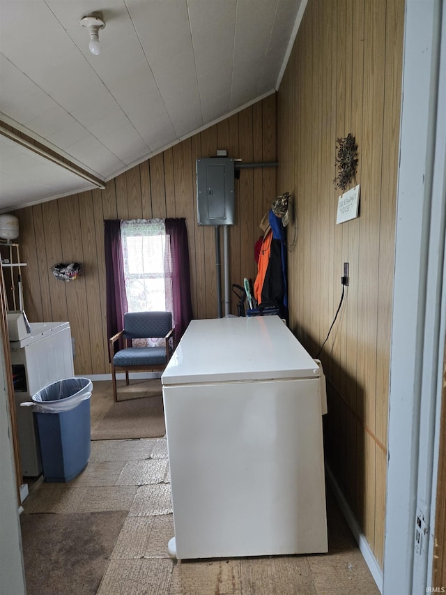 221 W 11th St, Bicknell, IN 47512 - washroom featuring washer / dryer, wooden walls, electric panel, and light carpet