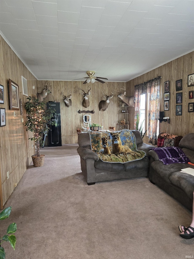 221 W 11th St, Bicknell, IN 47512 - living room with wooden walls, carpet, ceiling fan, and crown molding