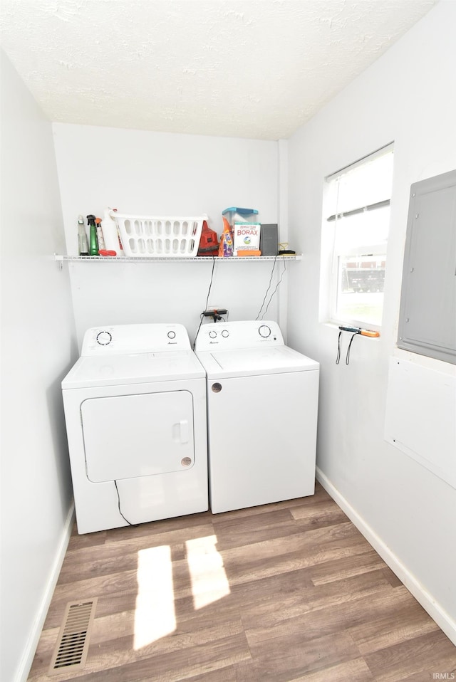 206 N Van Buren Ave, Fowler, IN 47944 - laundry area with separate washer and dryer, wood finished floors, and electric panel