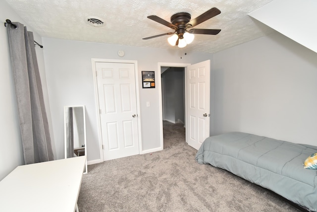 206 N Van Buren Ave, Fowler, IN 47944 - carpeted bedroom with a textured ceiling and a ceiling fan