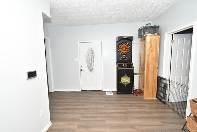 206 N Van Buren Ave, Fowler, IN 47944 - entrance foyer featuring wood finished floors and a textured ceiling