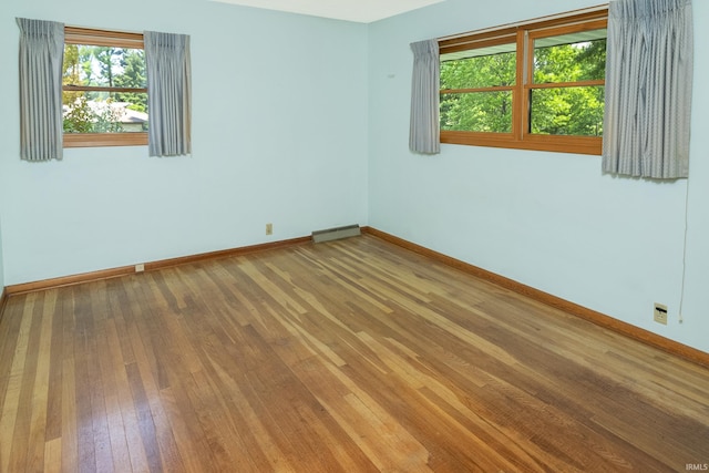 2330 N Fritz Dr, Bloomington, IN 47408 - unfurnished room featuring baseboards and hardwood / wood-style floors