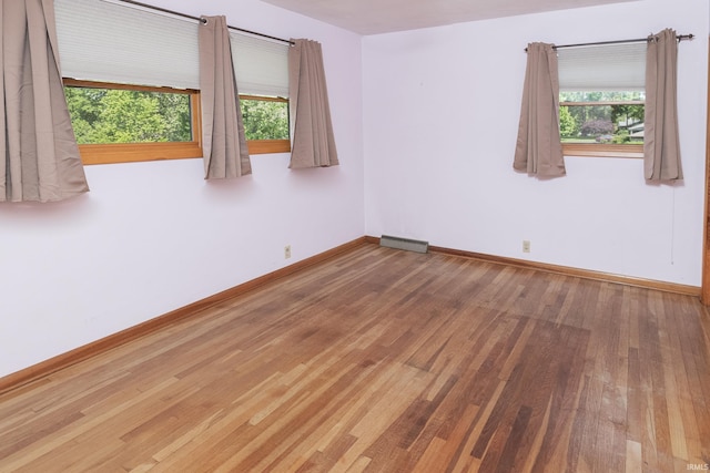 2330 N Fritz Dr, Bloomington, IN 47408 - spare room with healthy amount of natural light and wood finished floors
