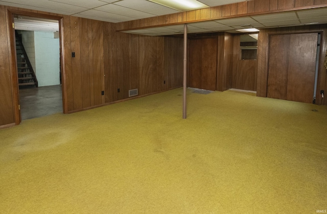 2330 N Fritz Dr, Bloomington, IN 47408 - finished basement featuring wood walls, stairway, carpet floors, and a drop ceiling