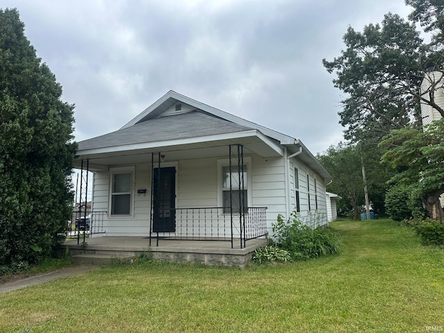 237 Stanley St, Mishawaka, IN 46545 - view of front facade with covered porch and a front lawn