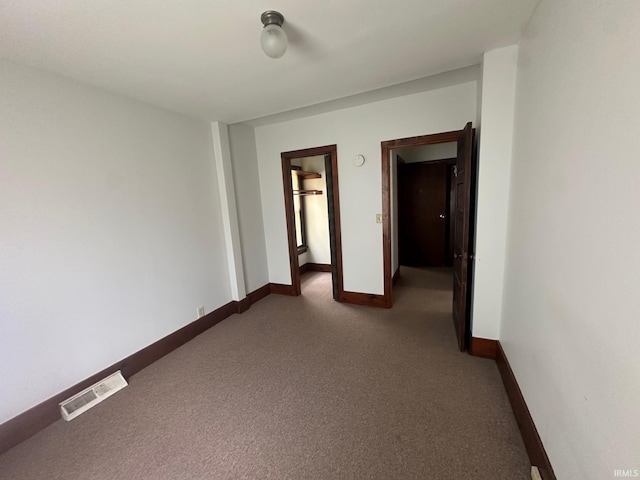 237 Stanley St, Mishawaka, IN 46545 - spare room with dark colored carpet and baseboards